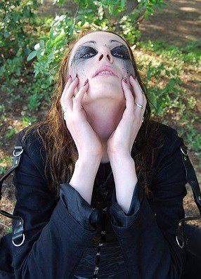 gothic clothes and makeup in the forest